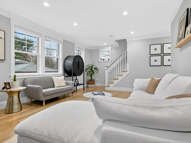 a living room with furniture or couch and a large window