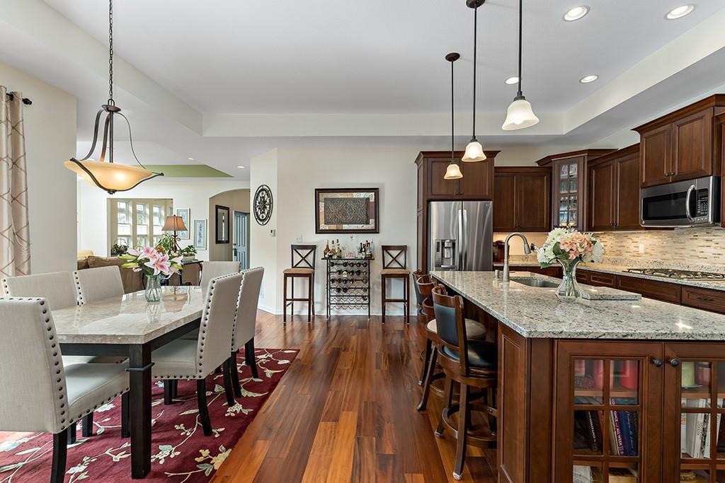 137 Cobblestone Drive Pittsburgh, PA 15237 - Photo 12 of 39 a kitchen with stainless steel appliances granite countertop a stove refrigerator and wooden floor