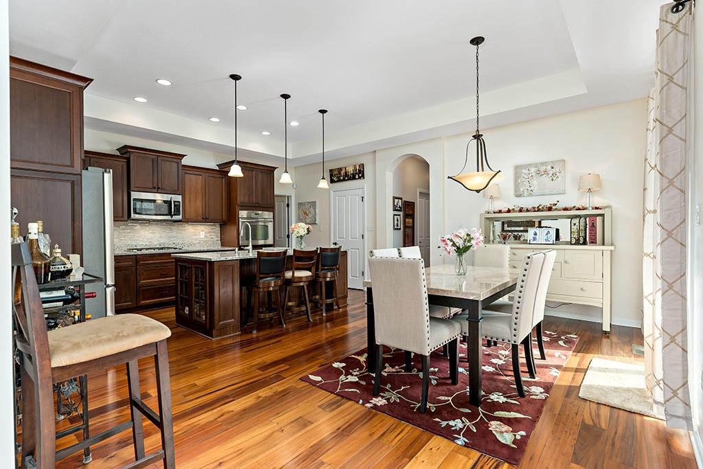 137 Cobblestone Drive Pittsburgh, PA 15237 - Photo 13 of 39 a view of a dining room and livingroom with furniture wooden floor a chandelier