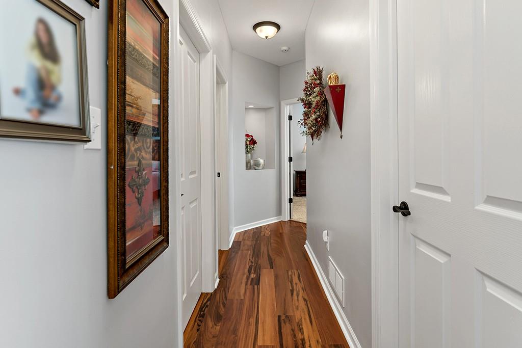137 Cobblestone Drive Pittsburgh, PA 15237 - Photo 17 of 39 a view of a hallway with paintings on the wall