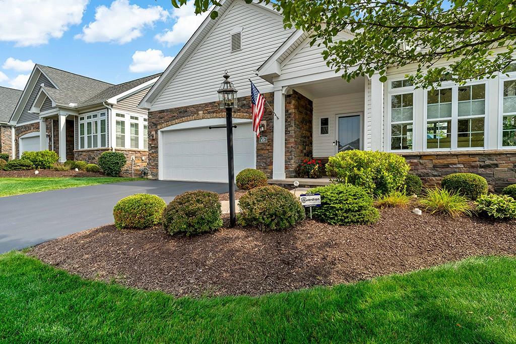 137 Cobblestone Drive Pittsburgh, PA 15237 - Photo 2 of 39 a front view of a house with garden and glass windows