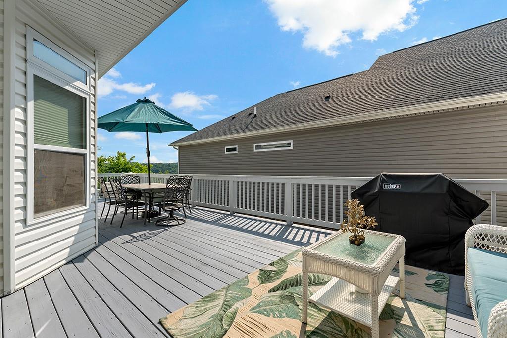 137 Cobblestone Drive Pittsburgh, PA 15237 - Photo 28 of 39 a view of a roof deck with table and chairs and wooden floor
