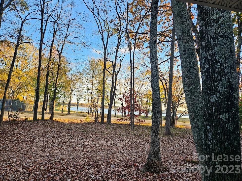 1205 Auten Road, Unit B Charlotte, NC 28216 - Photo 2 of 14 a backyard of a house with lots of green space