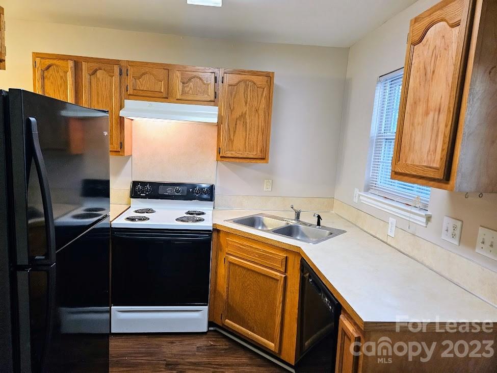 1205 Auten Road, Unit B Charlotte, NC 28216 - Photo 5 of 14 a kitchen with stainless steel appliances granite countertop a sink stove and refrigerator