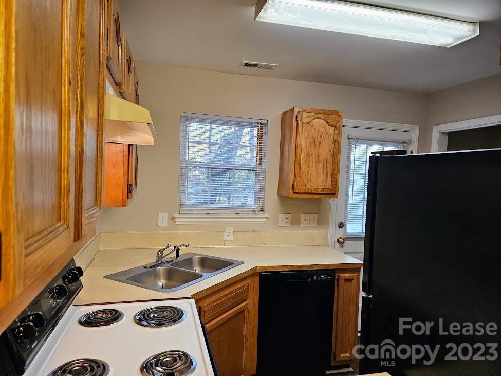 1205 Auten Road, Unit B Charlotte, NC 28216 - Photo 6 of 14 a bathroom with a sink and a mirror