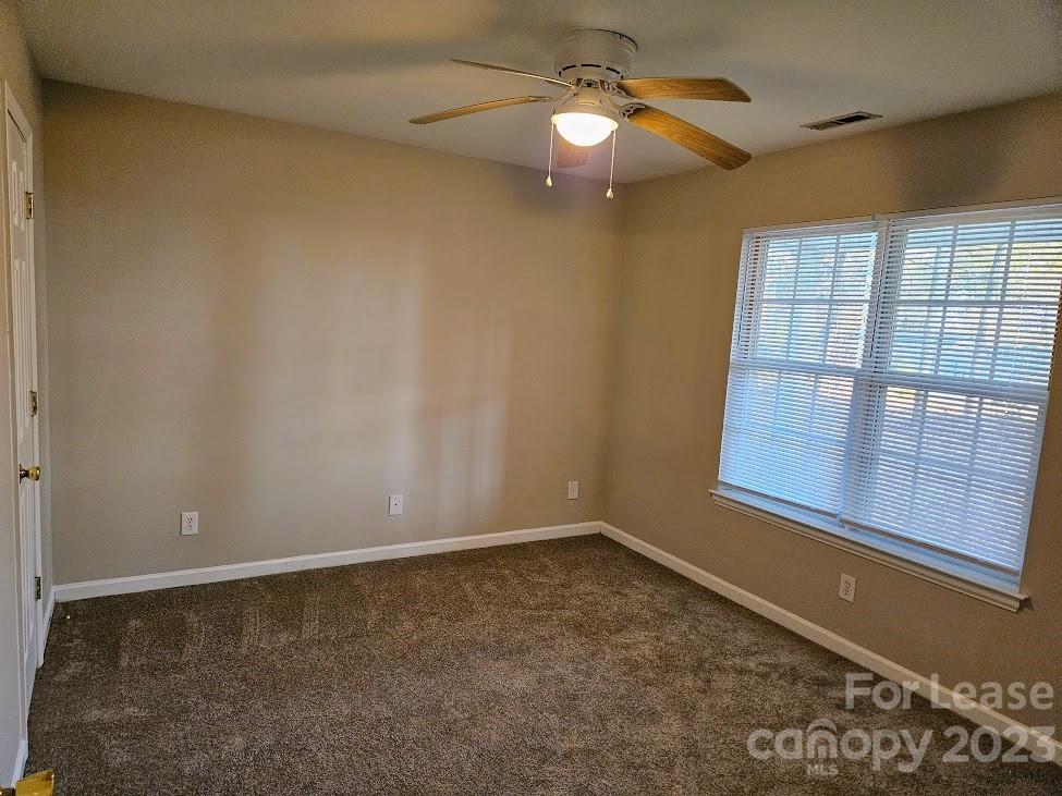 1205 Auten Road, Unit B Charlotte, NC 28216 - Photo 7 of 14 a view of an empty room with a window