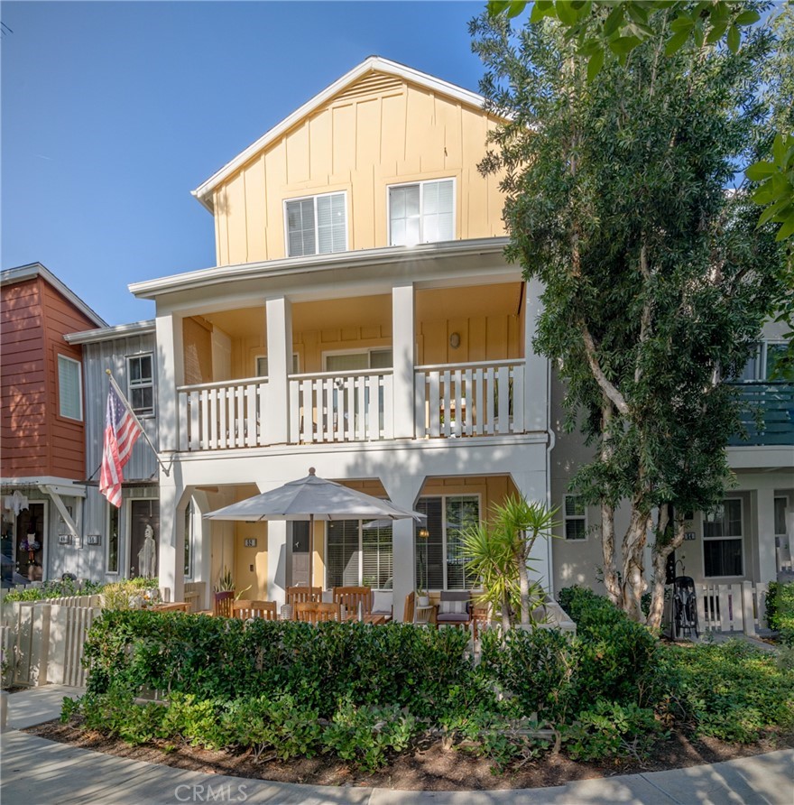 a front view of residential houses with yard
