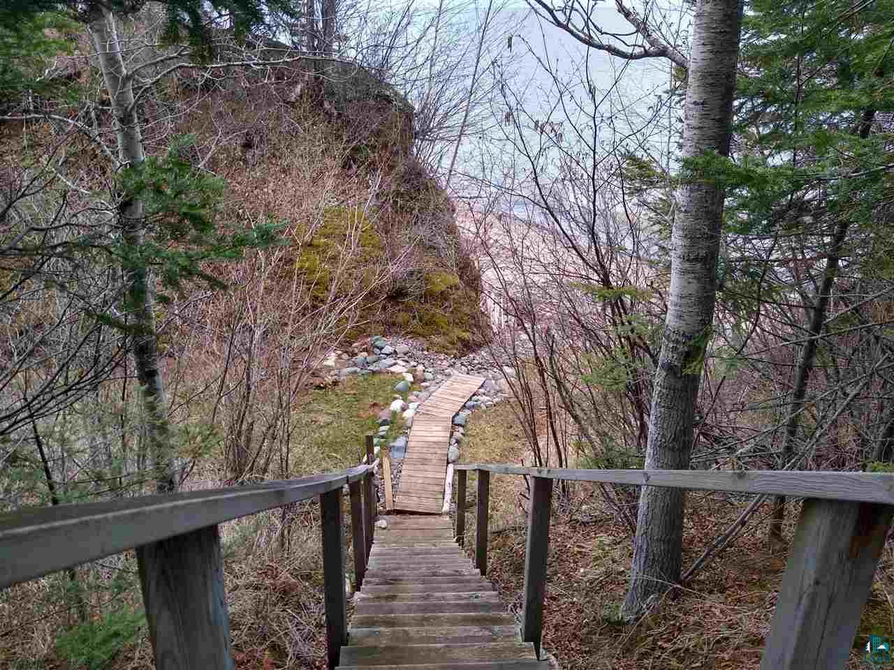 88525 Bark Point Road Herbster, WI 54844 - Photo 23 of 50 stairway has withstood the test of time by being tucked into ravine