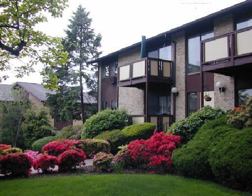 180 Glenbrook Road, Unit 61 Stamford, CT 06902 - Photo 1 of 1 a view of a house with a garden