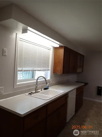 a view of kitchen with cabinets