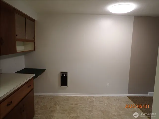 a room with a fireplace and a wooden floor