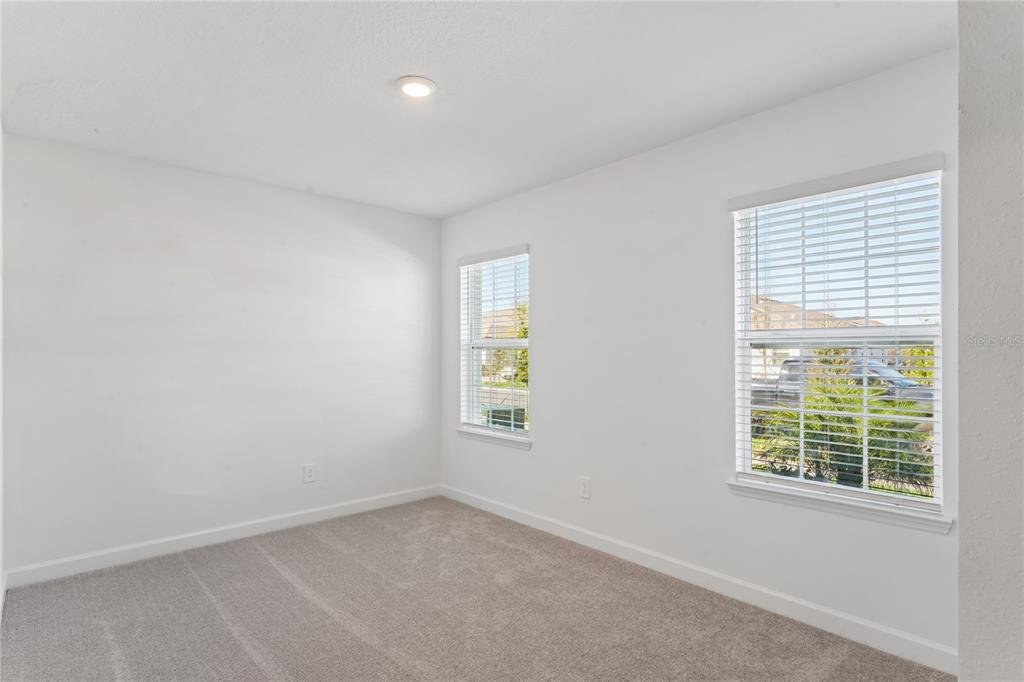 6692 Homebound Way New Port Richey, FL 34653 - Photo 29 of 47 an empty room with windows