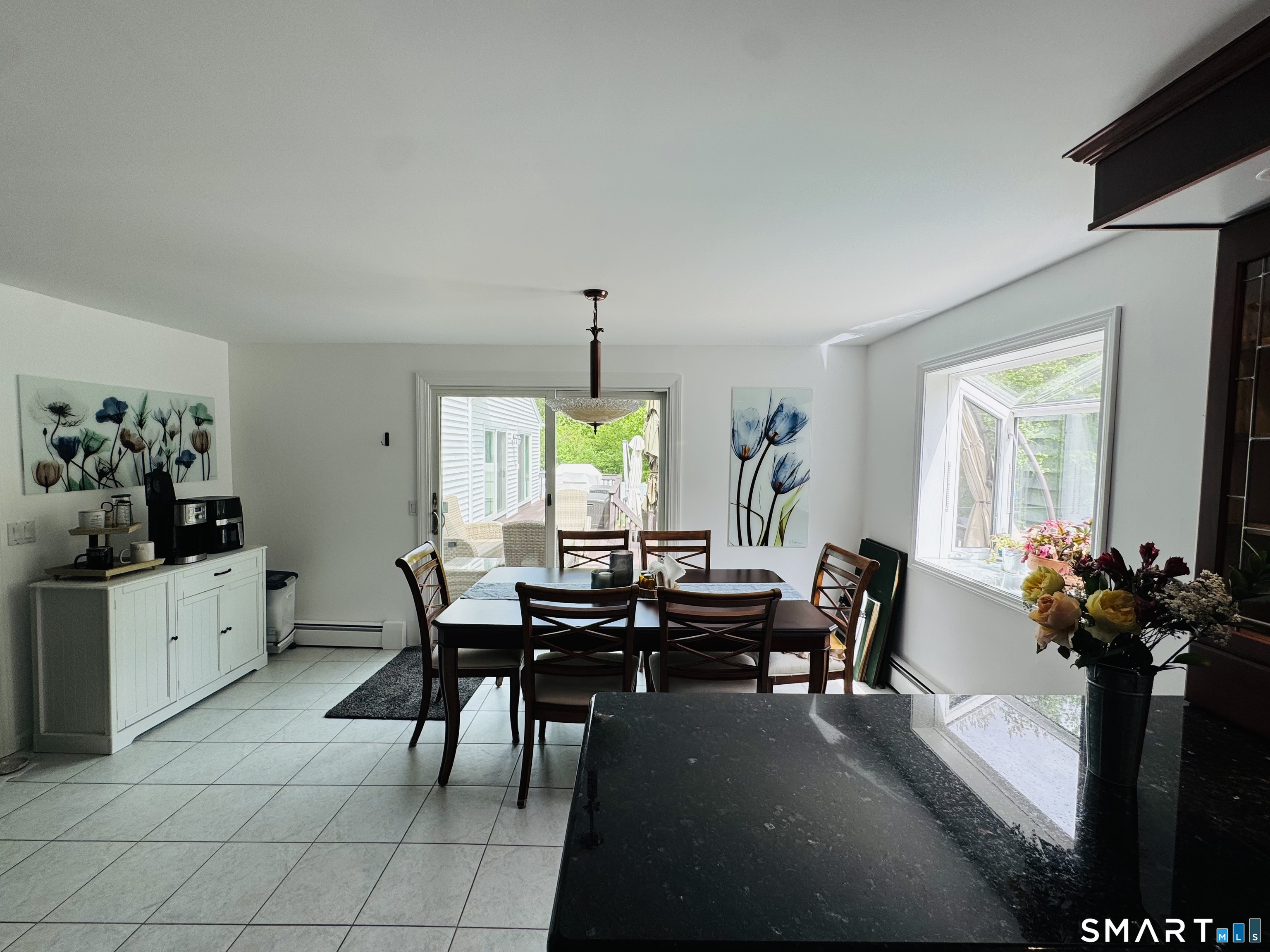 1514 Woodtick Road Wolcott, CT 06716 - Photo 7 of 23 a view of a dining room with furniture and chandelier