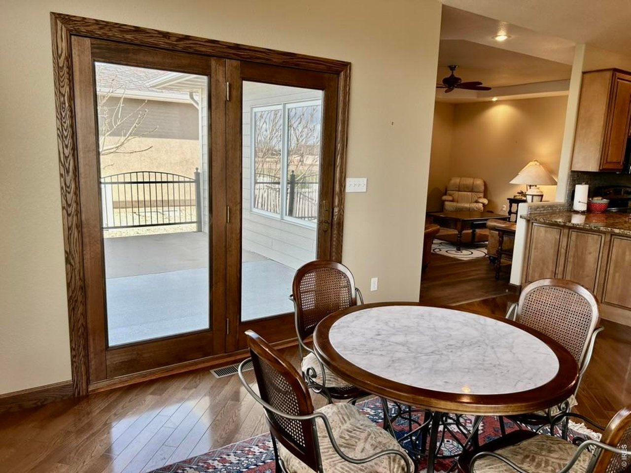 131 Club Road Sterling, CO 80751 - Photo 14 of 50 a view of a dining room with furniture and wooden floor