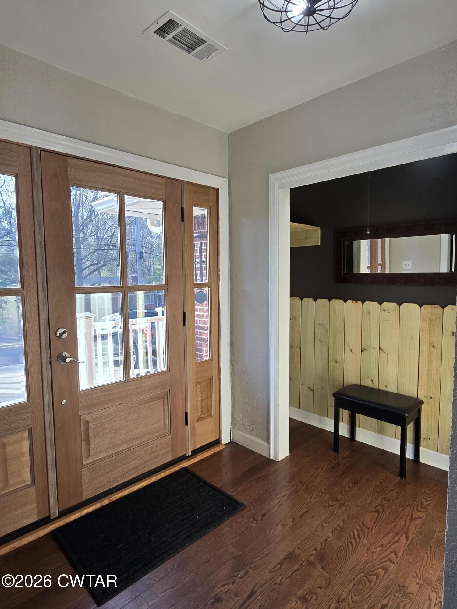232 Russell Road Jackson, TN 38301 - Photo 12 of 30 a view of a room with wooden floor and a window