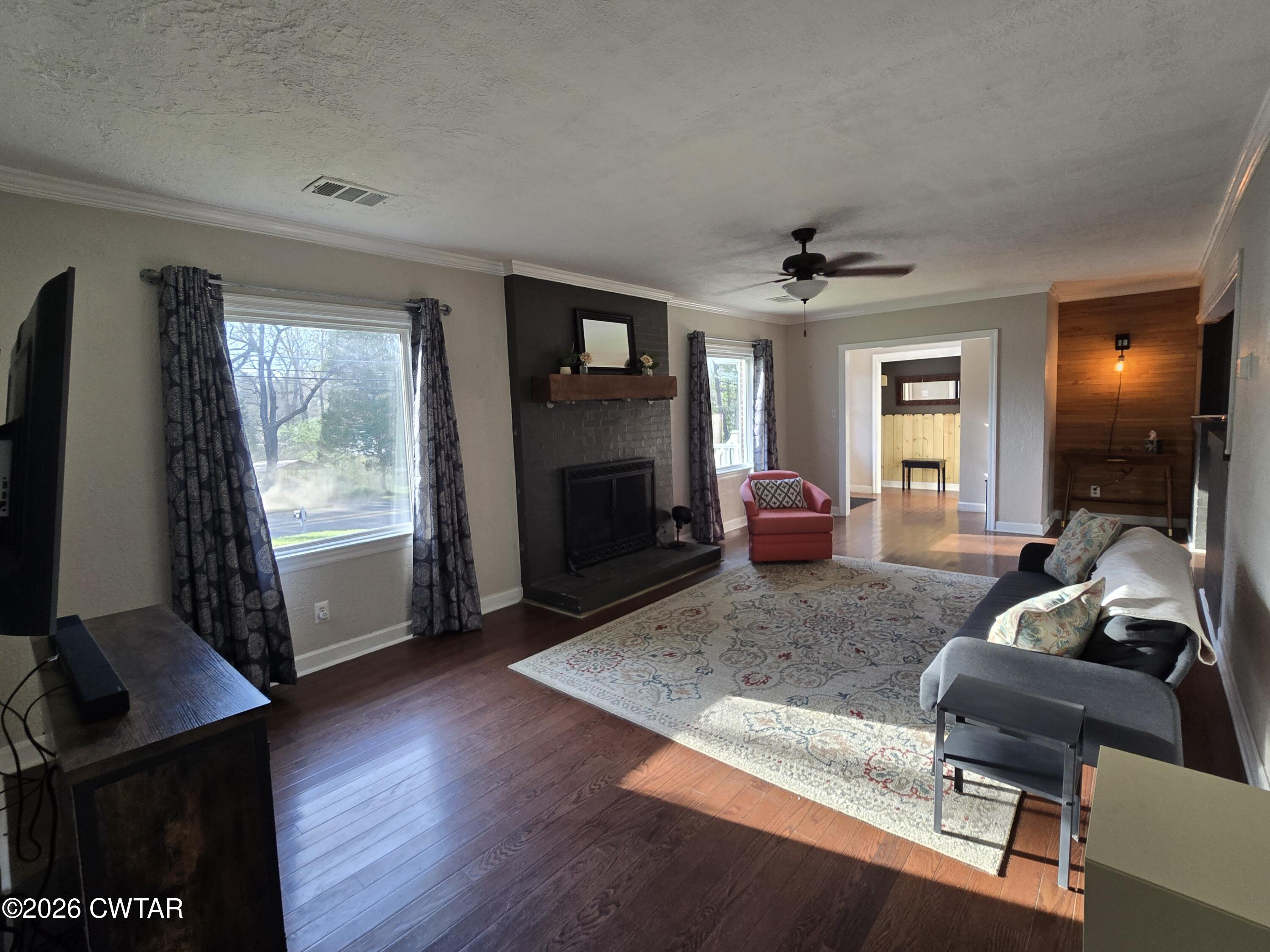 232 Russell Road Jackson, TN 38301 - Photo 13 of 30 a living room with furniture and a flat screen tv