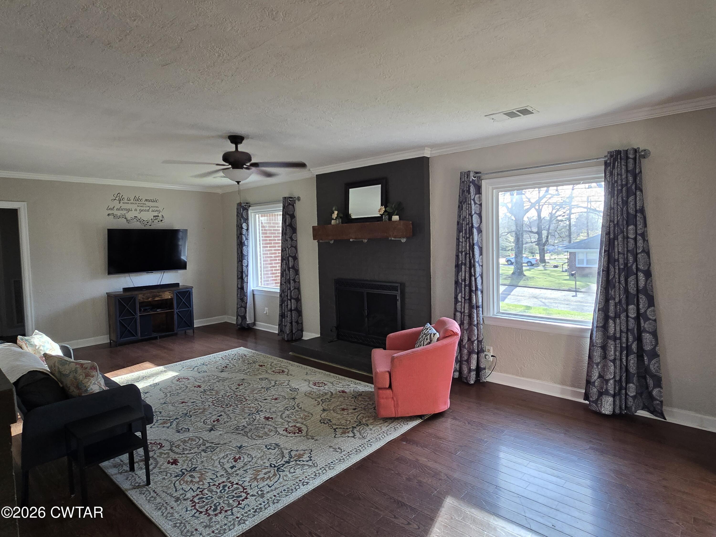 232 Russell Road Jackson, TN 38301 - Photo 14 of 30 a living room with furniture and a flat screen tv