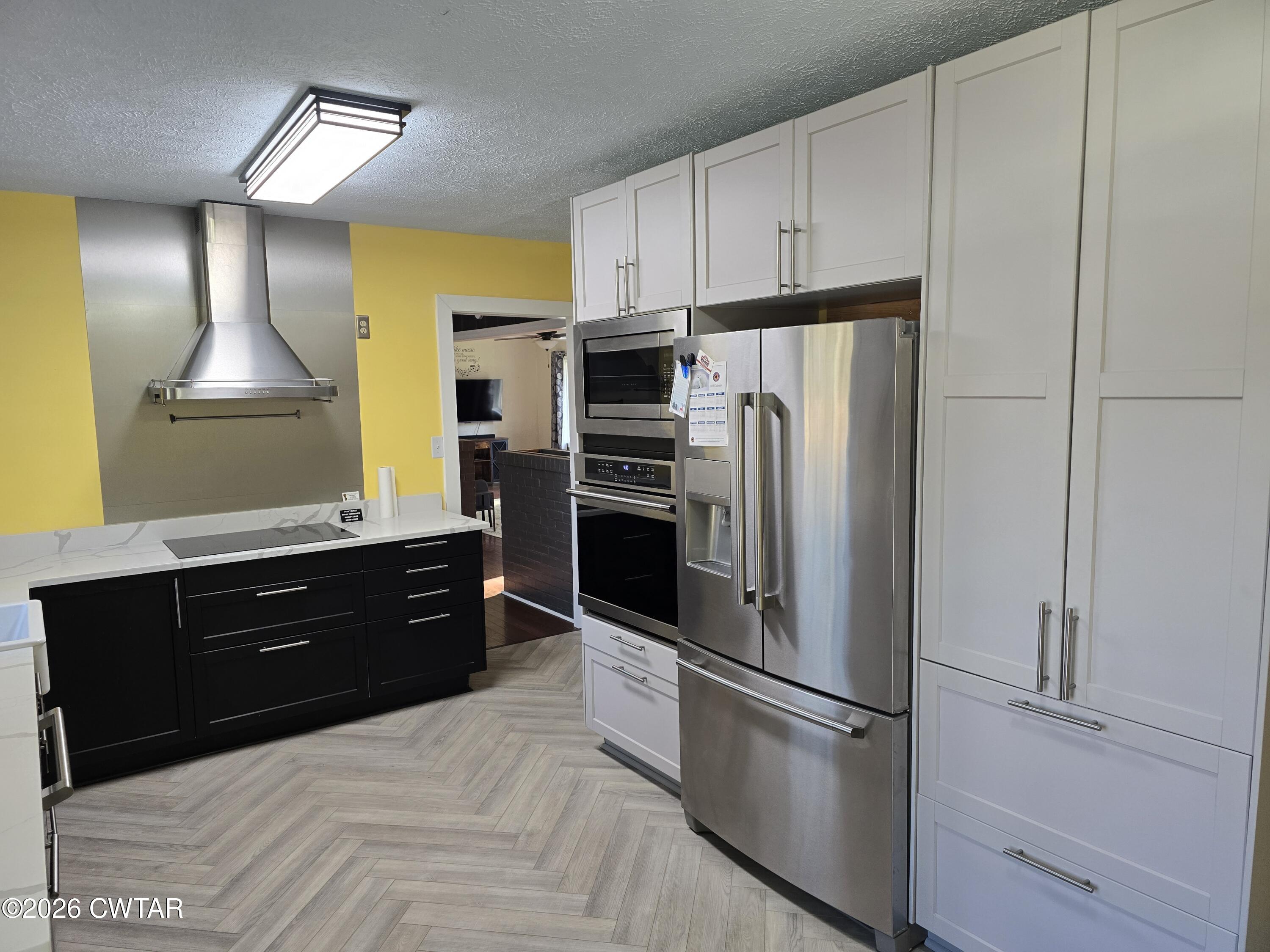 232 Russell Road Jackson, TN 38301 - Photo 17 of 30 a kitchen with a refrigerator and a sink