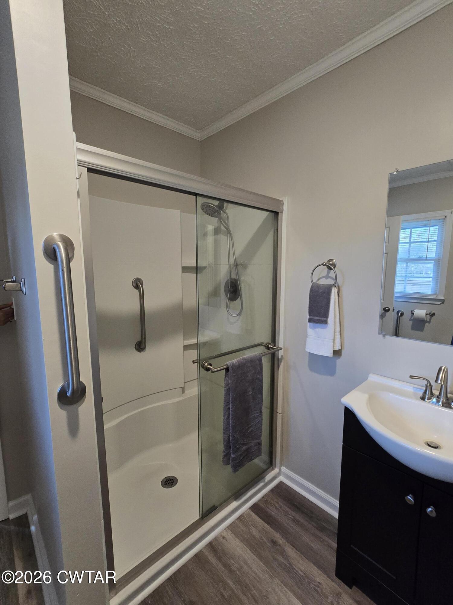 232 Russell Road Jackson, TN 38301 - Photo 25 of 30 a bathroom with a sink and a mirror
