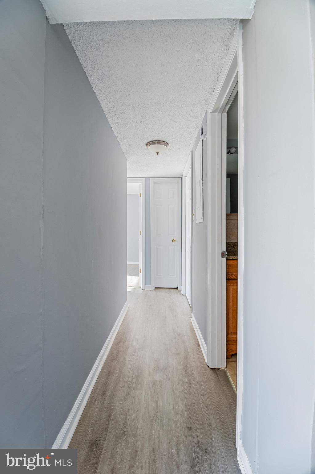 1822 Metzerott Road, Unit 205 Adelphi, MD 20783 - Photo 12 of 21 a view of a hallway with wooden floor