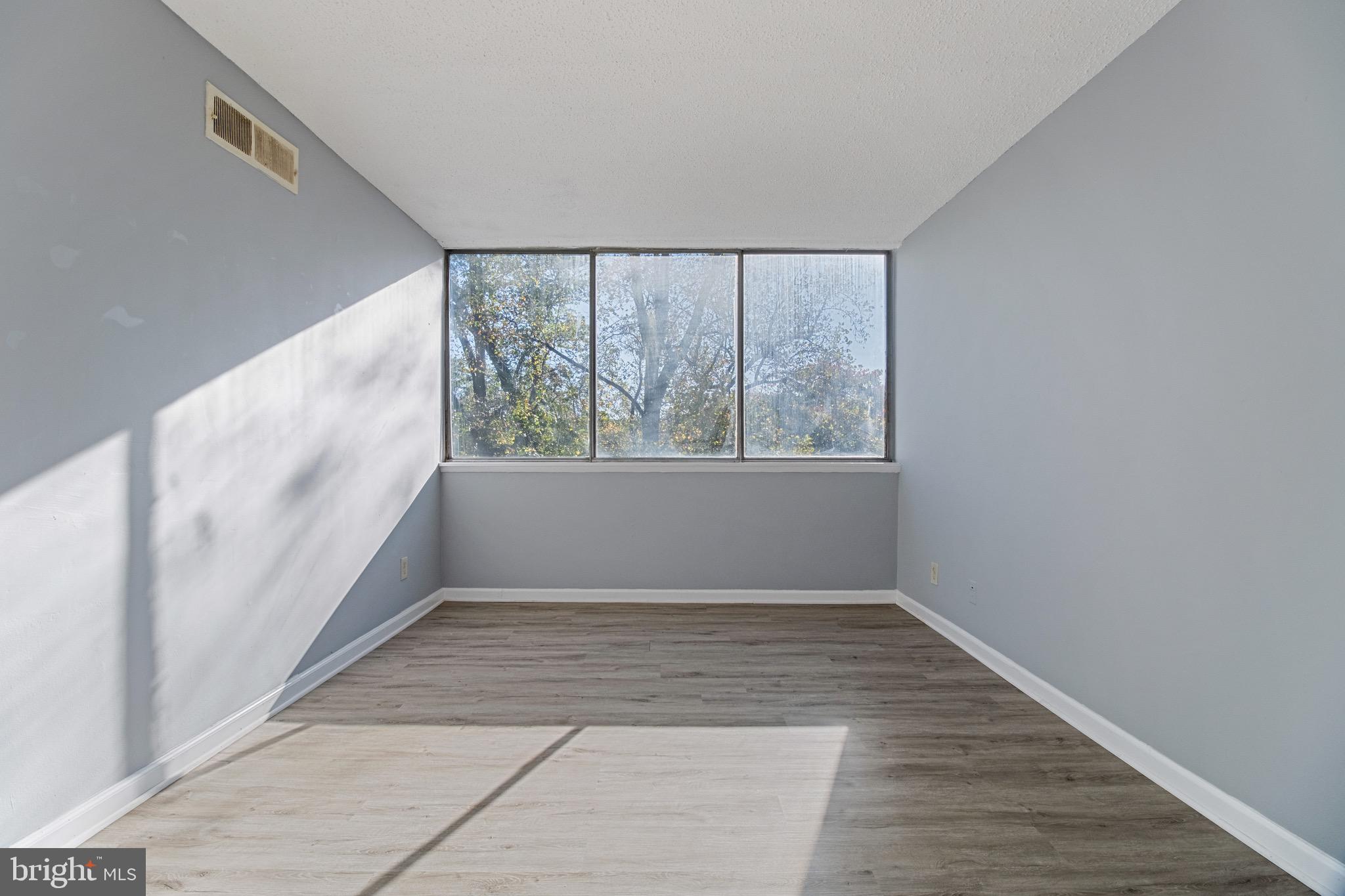 1822 Metzerott Road, Unit 205 Adelphi, MD 20783 - Photo 9 of 21 a view of an empty room with a window