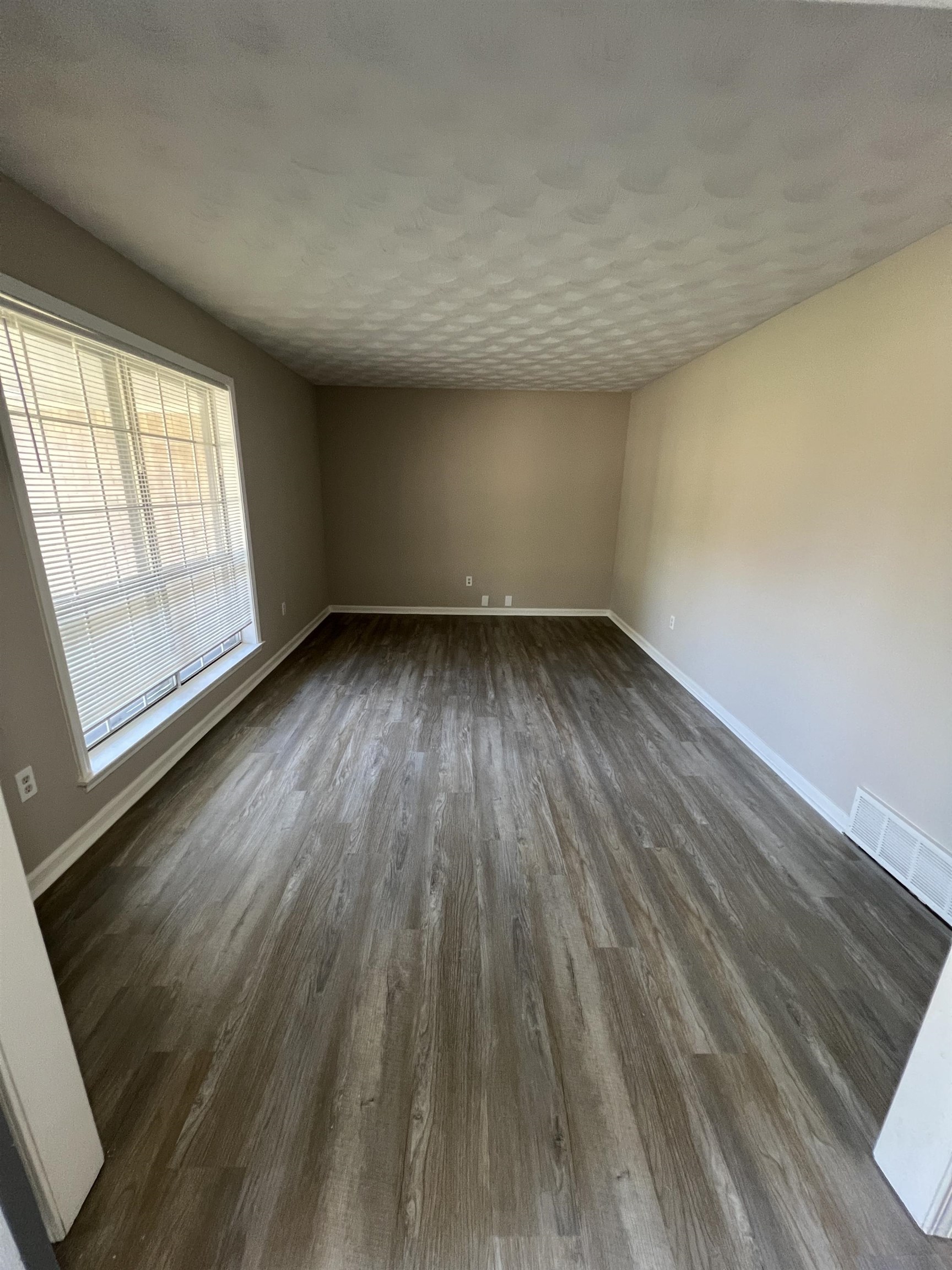 5159 Longmeadow Cove Memphis, TN 38134 - Photo 3 of 23 wooden floor in an empty room with a window