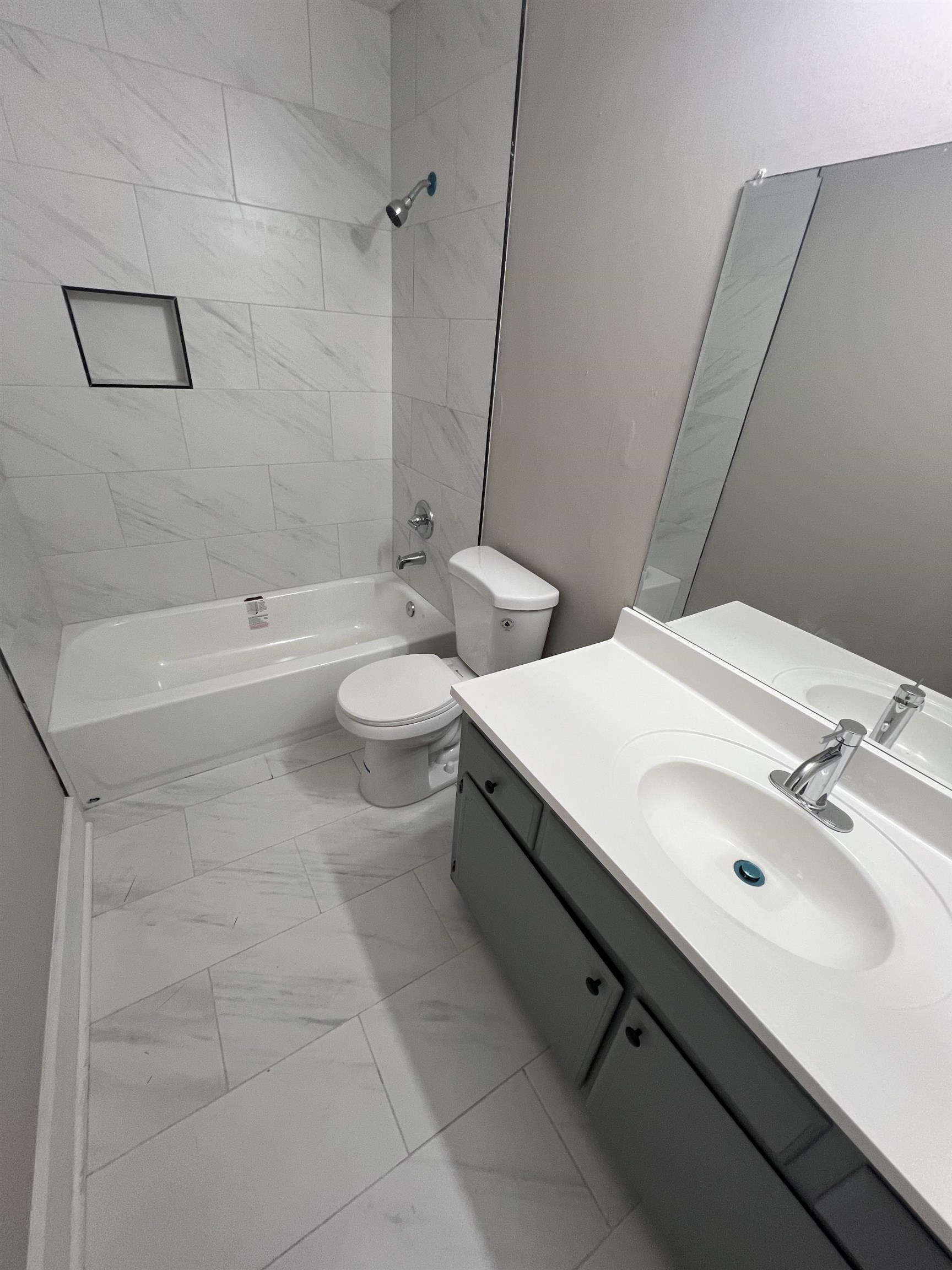 5159 Longmeadow Cove Memphis, TN 38134 - Photo 10 of 23 a bathroom with a double vanity sink toilet and shower