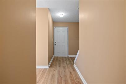 7253 Crestside Drive Austell, GA 30168 - Photo 2 of 14 a view of a hallway with wooden floor