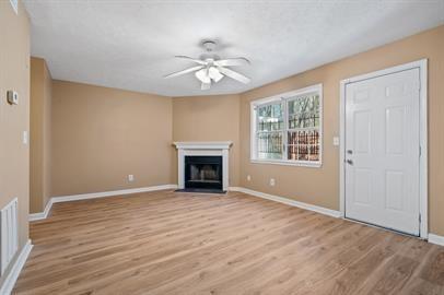 7253 Crestside Drive Austell, GA 30168 - Photo 6 of 14 a view of an empty room with wooden floor and a window