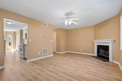 7253 Crestside Drive Austell, GA 30168 - Photo 7 of 14 wooden floor in an empty room with a fireplace