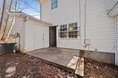 a view of house with backyard