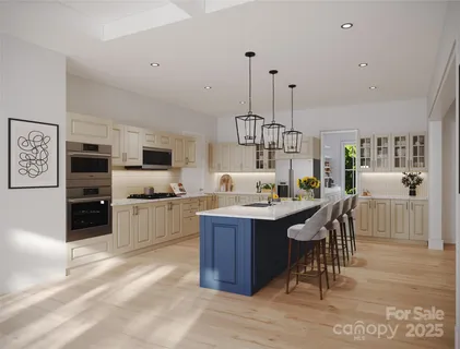 a kitchen with stainless steel appliances kitchen island granite countertop a sink and cabinets
