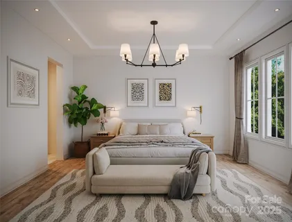 a bedroom with a bed and a chandelier