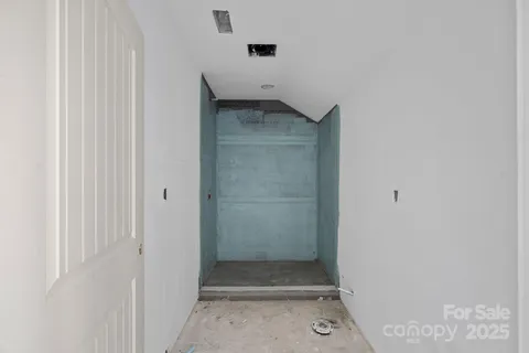 a view of a patio with table and chairs next to a yard