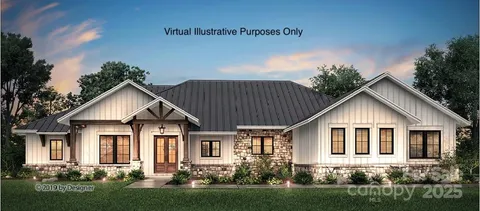 a front view of a house with a yard and potted plants