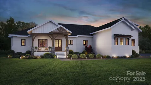 a front view of a house with a garden and plants