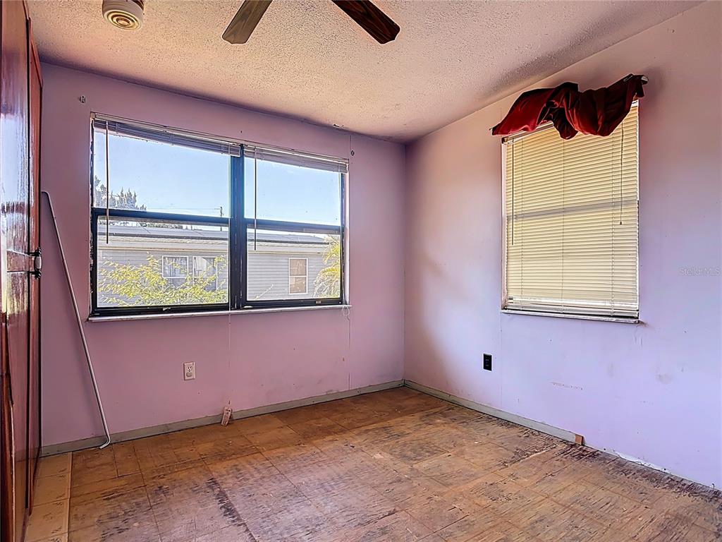 13005 Florida Avenue Astatula, FL 34705 - Photo 18 of 48 a view of an empty room with a window