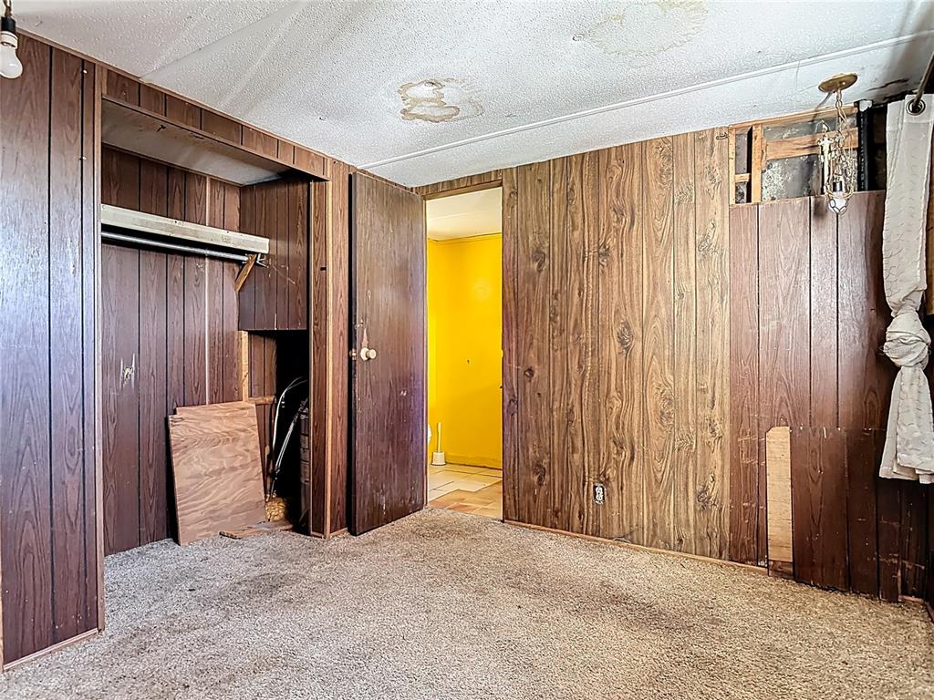 13005 Florida Avenue Astatula, FL 34705 - Photo 22 of 48 a view of room with furniture and a window