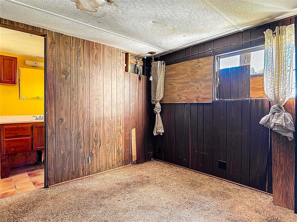 13005 Florida Avenue Astatula, FL 34705 - Photo 23 of 48 a view of an empty room with a window