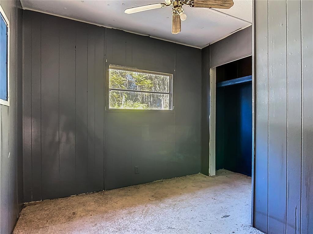 13005 Florida Avenue Astatula, FL 34705 - Photo 28 of 48 a view of an empty room with a chandelier fan