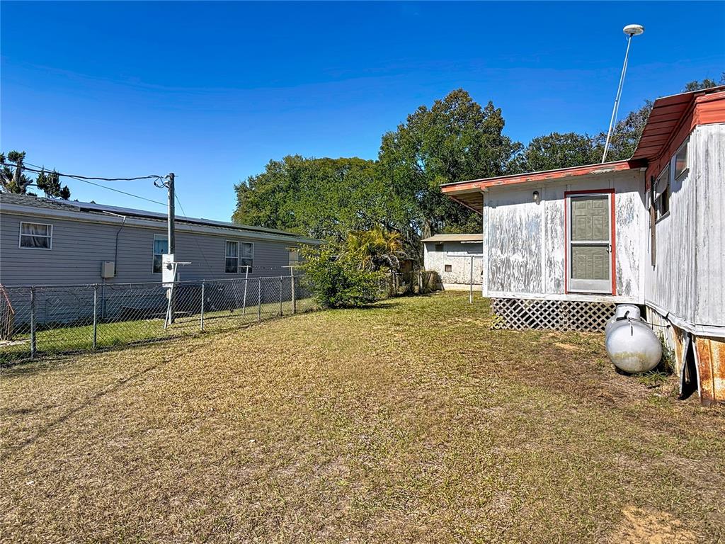 13005 Florida Avenue Astatula, FL 34705 - Photo 36 of 48 a house view with a backyard space