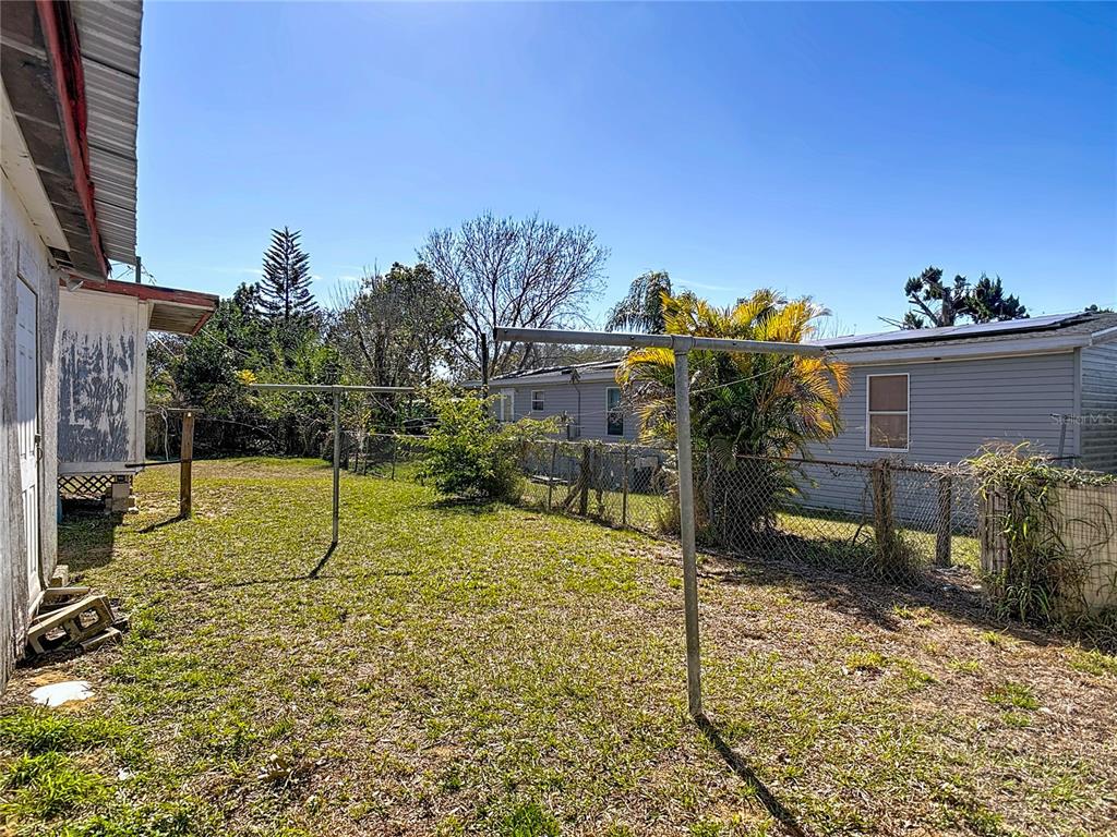 13005 Florida Avenue Astatula, FL 34705 - Photo 39 of 48 a house with trees in front of it