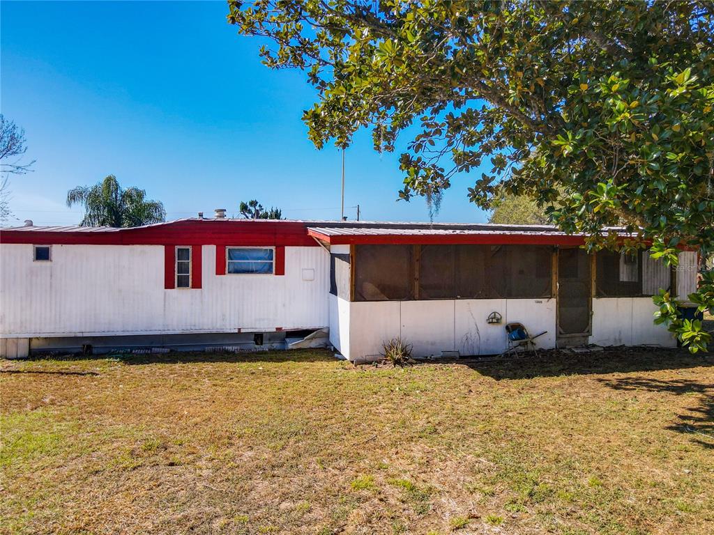 13005 Florida Avenue Astatula, FL 34705 - Photo 40 of 48 a front view of a house with a yard