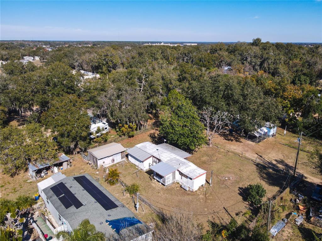 13005 Florida Avenue Astatula, FL 34705 - Photo 4 of 48 an aerial view of residential houses with outdoor space