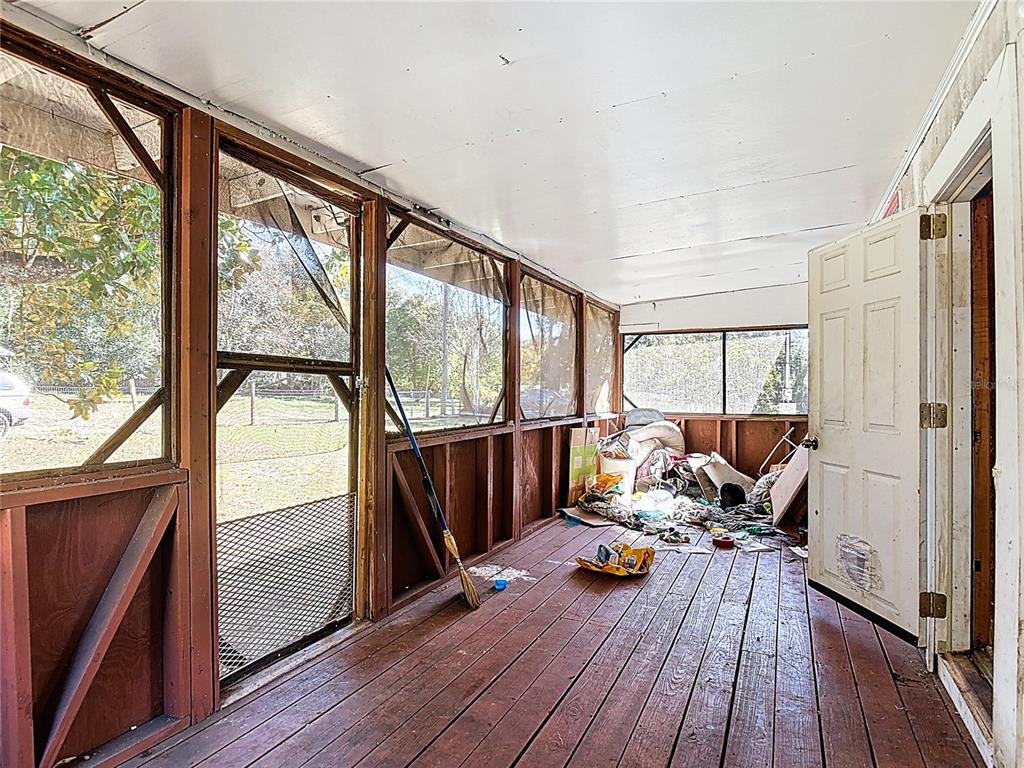 13005 Florida Avenue Astatula, FL 34705 - Photo 6 of 48 a living room with furniture and a large window
