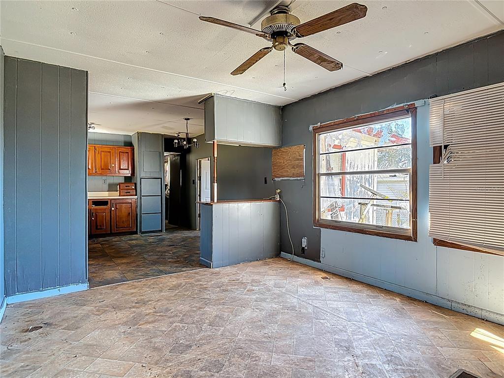 13005 Florida Avenue Astatula, FL 34705 - Photo 9 of 48 an empty room with a window and stainless steel appliances
