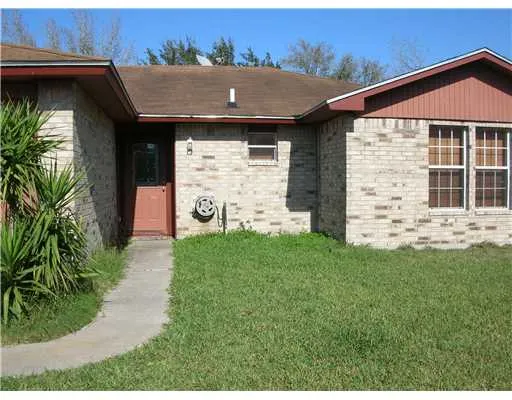 a aerial view of a house with garden