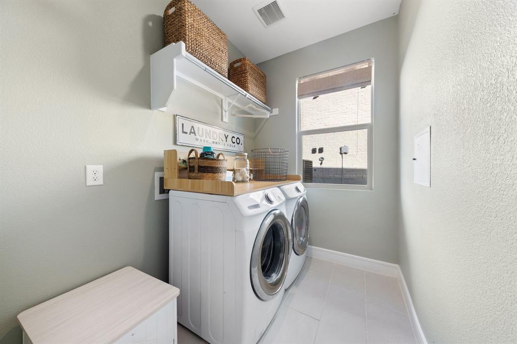 1340 Cartona Road Fate, TX 75087 - Photo 22 of 32 a utility room with dryer and washer