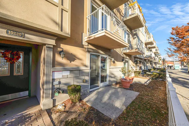 a utility room with wooden floor washer and dryer