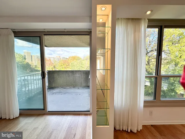 a view of front door and porch with wooden floor